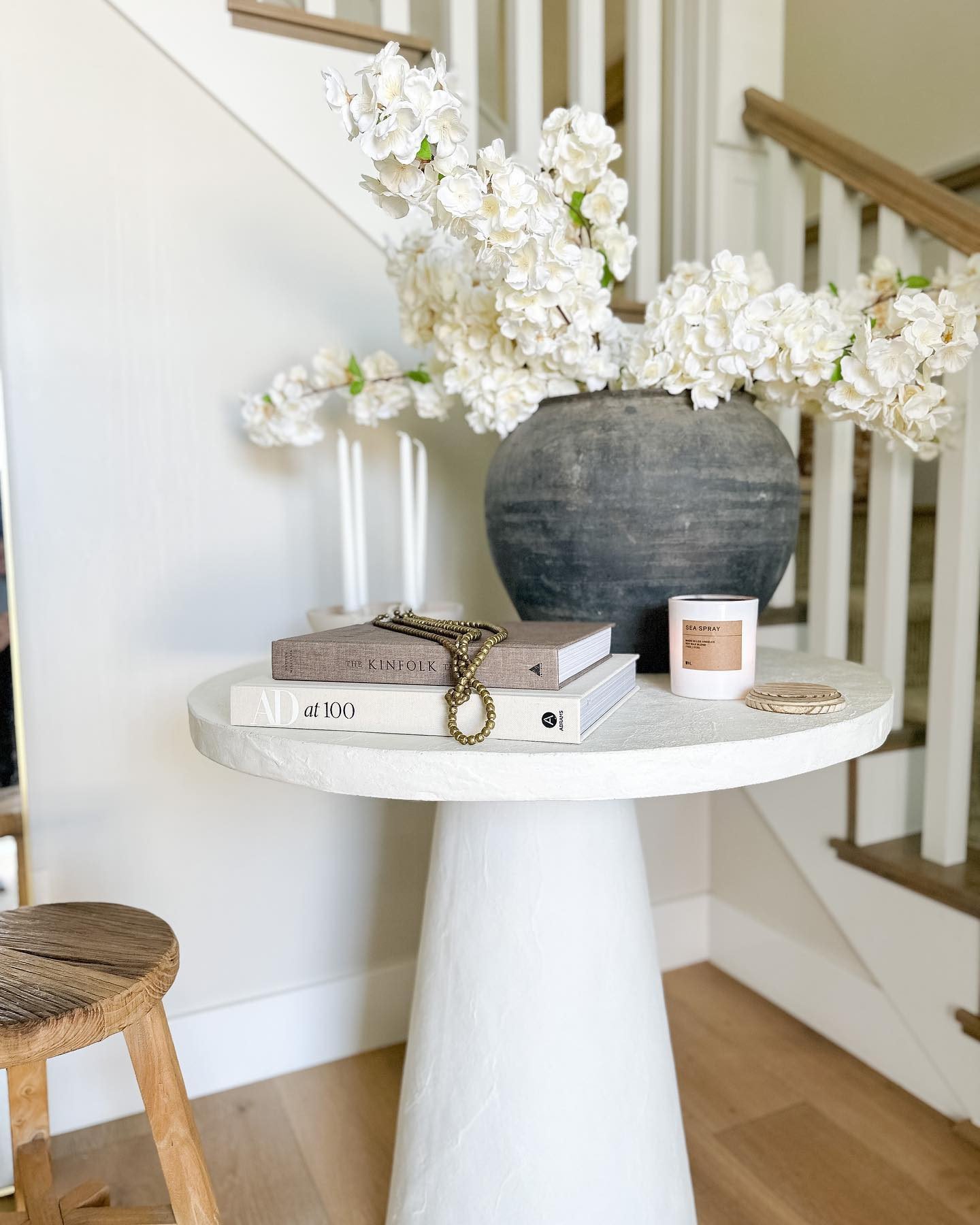 White pedestal side discount table