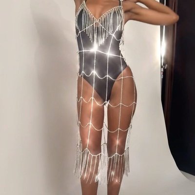 it’s Saturday night, so dress like it ✨ the Crystal Fringe Dress slips over just about anything with swinging crystal fringe that brings the party