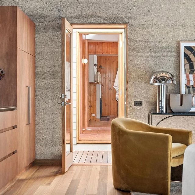 Organic finishes meet chrome accents in perfect harmony ✨ @the.uncommon.room creates balance, anchored by the elegant Dome lamp